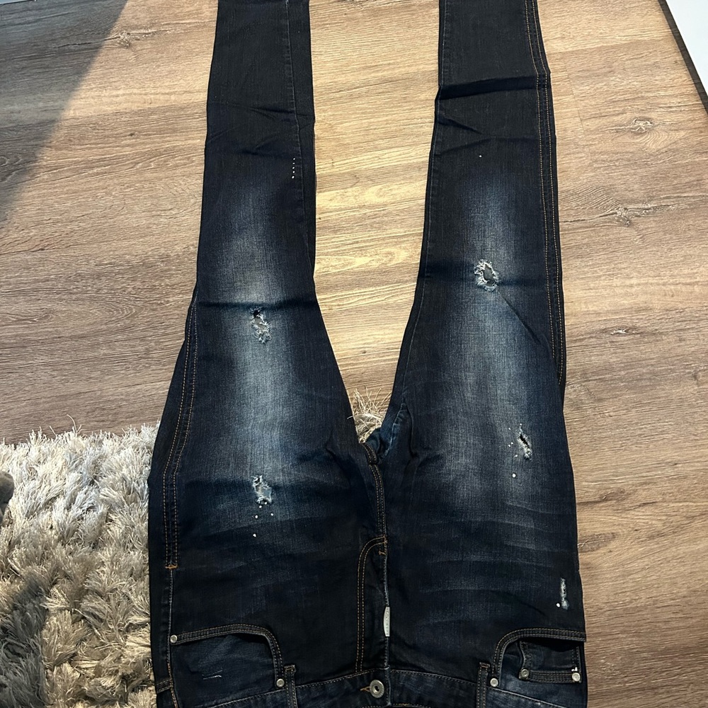 Represent dark blue denim skinny jeans